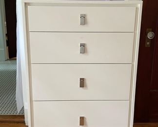 Four Drawer Laminate Chest of Drawers with Brushed Metal Pulls. Measures 29" W x 18" D x 45" H. Photo 1 of 2.