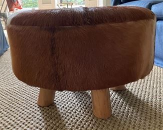 Cowhide Upholstered Ottoman. Measures 24" D x 16" H. Photo 2 of 2.