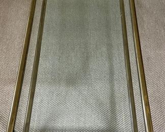 Mastercraft- Style Brass & Glass Cocktail Table on Casters. Measures 58" W x 24" D x 16" H. Photo 1 of 3.