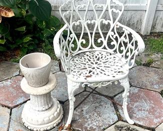 Antique White Wrought Iron Chair. Concrete pedestal and planter