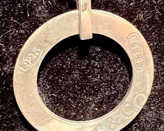 TIFFANY & CO LARGE STERLING ROUND PENDANT AND CHAIN.