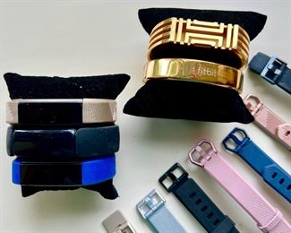 FITBITS, BANDS, AND TORY BURCH BAND.