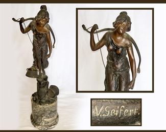 Victor Seifert Statue; (bottom of top bucket is missing)