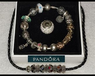 Pandora Bracelet Filled with Gold and Sterling Charms and Lg Pc in the Center is Brighton, there is another smaller Pandora Bracelet Available as well 