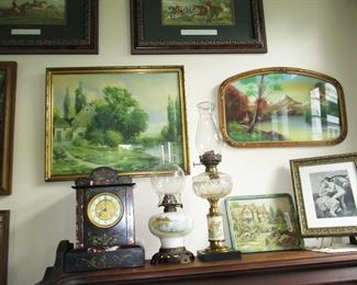 Sampling of wall art, oil lamps (2 of dozens) and wonderful early mantle clock