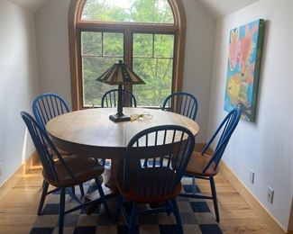 Antique round oak table with newer oak chairs