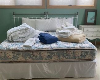 King bed with vintage iron headboard 