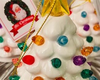 Several Mr Christmas Lighted Christmas Trees