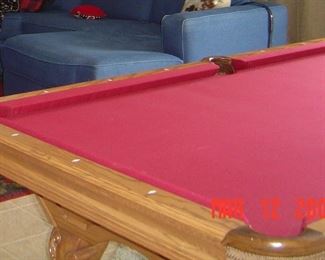 Brunswick Avalon pool table. Includes cover, balls, and que sticks
