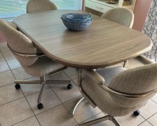 Dinette Set, shown with leaf in. 4 Upholstered Chairs on castors