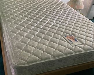 Sealy Posturepedic Queen mattress .  Platform bed frame
