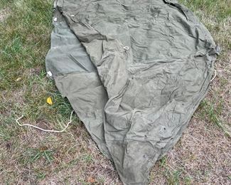 US Army issued tent consisting of 2 'shelter halves' in OD green. Typically issued to officers.