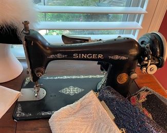 Antique singer sewing machine in cabinet 