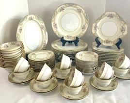 Noritake "Phoebe" China Grouping including 12 dinner plates, 12 salad plates, 11 dessert plates, 12 small bowls, 12 soup bowls, 12 cups, 12 saucers and a platter. Stunning design! 