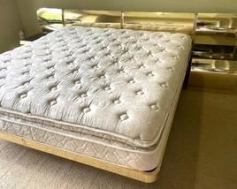 Contemporary  Gold and Bronze Toned King Bed with Attachable Nightstands. The headboard measures 33 inches tall and is 120 inches long including the attached nightstands.