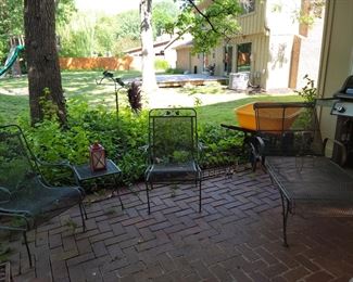 Lots of outdoor wrought iron furniture