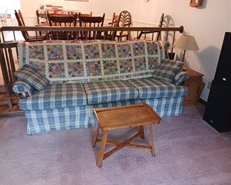 Blue and white plaid sofa, antique quilt
