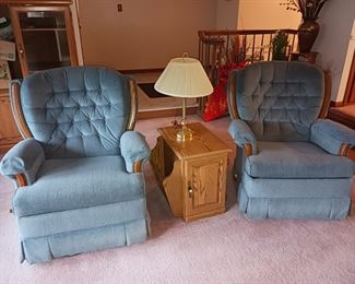 Blue upholstered recliners tufted