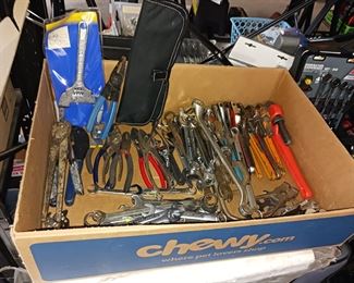 Box of hand tools wrenches wire cutters