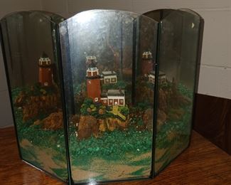 Terrarium with a lighthouse inside