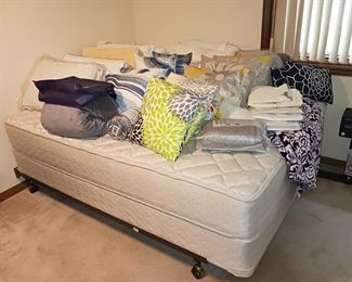 Several decorative pillows brand new queen mattress and box spring