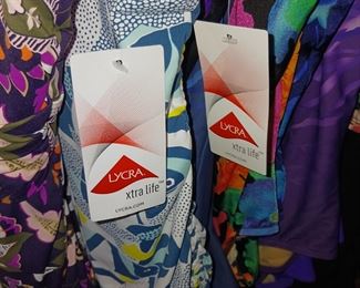 Several women's bathing suits still with tags