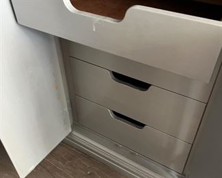 Middle of dresser cabinet has drawers