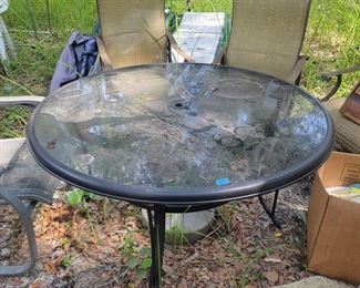 Round Plastic top Patio Table $65, 2 of the 6 brown patio chairs $120