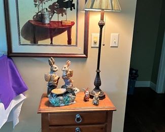 Very nice three drawer side table, lamps, pictures, and lots of rabbit decor