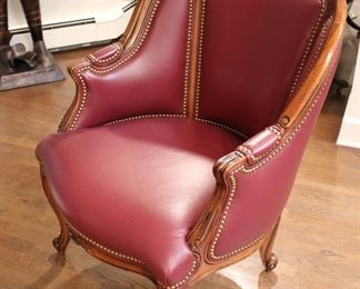Red leather armchair with nailhead trim