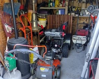 Storage shed packed with goodies for outdoor yard work