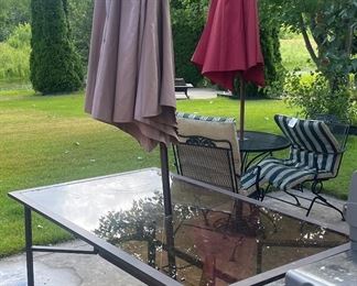 Patio table with six chairs and umbrella