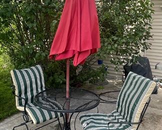 Wrought iron bistro set with umbrella