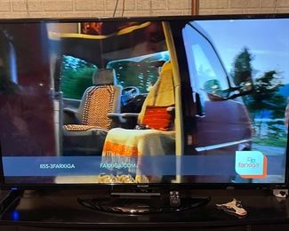 Flat screen TV turned on so you know it works