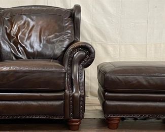 Leather arm chair and ottoman with nailhead embellishments