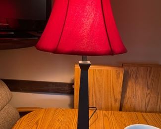 Table lamp with a pretty red shade to match