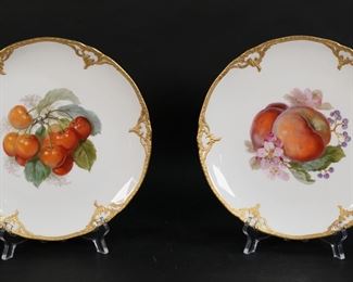 33	2 KPM Porcelain Fruit Plates	Pair of KPM porcelain plates. Hand painted fruit motifs, gilt decorated rims. Both with KPM orb and cross and blue painted scepter marks. Each 8 1/8"-diameter.
