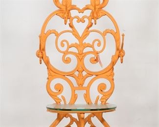 46	Victorian Painted Cast Iron Coat Tree	"Victorian painted cast iron coat tree. 19th century, later orange paint and glass top added 21st century. With coat and hat hooks, umbrella stand, and removable drain tray. Modulus Moduli retail tag tied to coat tree. Paint losses and wear throughout coat tree. 

26 1/4"" W x 16"" D x 73 3/4"" H. 119 lbs."
