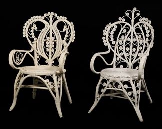 47	Two Victorian Style White Wicker Chairs	"Two Victorian style white wicker chairs in the manner of Heywood Wakefield 20th century. White wicker, bentwood, spiral wicker motifs. Separations, scuffs, and losses to wicker on feet of both chairs. Losses to spiral motifs on top right of back of smaller chair. Four spiral motifs from larger chair are separated but present. Remnants of glue and tape from previous repairs on backs of both chairs. 

Larger chair: 24 1/2"" W x 23 1/2"" D x 45 3/8"" H. Smaller chair: 23 1/2"" W x 19 1/4"" D x 40 1/4"" H. 22 lbs."

