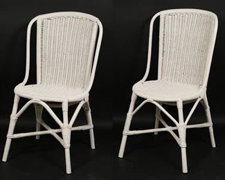 48	Pair of Thonet Style Bentwood Wicker Chairs	"Pair of Mid Century Modern bentwood wicker chairs in the style of Thonet. 20th century. Bentwood rattan and white-painted wicker. No brand marks or labels present. Paint losses throughout both chairs. Small loss to wicker on back of one chair. Separation to woven wicker on center on back of one chair. Scuffs to bentwood frames of both chairs. 

18"" W x 21"" D x 33 1/2"" H. 14 lbs. total."

