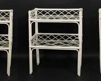 50	Three Hollywood Regency Rattan and Wicker Stands	"Three Hollywood Regency nightstands or side tables. 20th century. White-painted wicker and rattan. Pair of nightstands has two glass shelves each. Glass missing from smallest stand. Scuffs, scratches and wear to glass. Chips and fleabites to glass on edges on three pieces. Paint losses, chips, and wear to rattan and wicker on all three nightstands. 

Largest piece: 21 7/8"" W x 13 7/8"" D x 27 1/8"" H. 30 lbs total."

