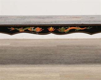 51	Chinoiserie Lacquered Cocktail Table	"Chinoiserie lacquered cocktail table. 20th century. Chinese spade-form legs, figural scene on top, dragon and floral motifs on apron. Crazing, scuffs, and wear throughout top of table. Losses to lacquer on one section of top.  Scratches and scuffs to lacquer throughout legs. Small chips to wood on edges of top. 

44"" W x 19 5/8"" D x 13 5/8"" H. 21 lbs."
