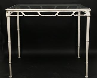 55	Hollywood Regency Metal Bamboo Form Outdoor Table	"Hollywood Regency metal bamboo form outdoor table. 20th century. White painted metal table in bamboo form with glass top. Scratches and scuffs to glass. Wear, losses to paint, scratches and scuffs throughout metal of table base. 

34 3/4"" W x 34 3/4"" D x 29 1/8"" H. 47 lbs."

