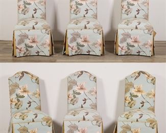 61	Six Hollywood Regency Style Dining Chairs	"Six Hollywood Regency style dining chairs. 21st century. High back chairs with nailhead trim and faux floral design slip covers. Wear to slip covers. Fraying to threading on top of one chair. Nicks and scuffs to wood on legs of chairs. 

21"" W x 25 5/8"" D x 41 5/8"" H. Seat height 20"" H. Each chair weighs 20 lbs."

