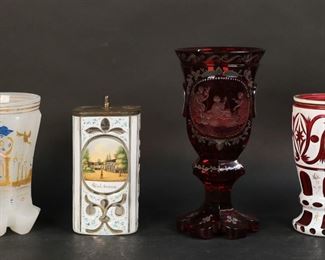 93	4 Pieces Bohemian Glass	"4 piece Bohemian glass lot. Ruby goblet with painted decoration and engraved scene, 7 1/2""H; Salzbrunn tea canister with brass lid, 5 1/4""H; opaline beaker with hand painted Chinoiserie crane decoration, 5 1/2""H; cranberry beaker with white overlay and floral decoration, 5 1/2""H.

Chip to one foot of ruby goblet, losses to lettering on tea box, chips to feet of opaline beaker, fleabite to base of cranberry beaker and scratches to gilt rim."
