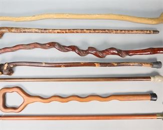 102	Lot of 7 Carved Canes & Walking Sticks	Lot of 7 canes and walking sticks, including 1 signed J. Skvarla, 1 signed Lean on Me Portland Maine, 1 with gold tone handle, 1 with bone handle with duck decoration. Cane with gold tone handle 36 1/2"L. All with minor scratches and wear.
