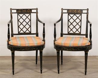 106	Pair of Regency Style Chinoiserie Caned Armchairs	"Pair of Regency style chinoiserie caned armchairs. Late 19th/early 20th century. Caned seats, reeded legs, fretwork splats. Later upholstered cushions to each chair. Scuffs, scratches, and losses to lacquer, gilding, and wood throughout each chair. Caning of one chair is almost completely separated from seat. Pilling and stains to upholstery on cushions. 

20 1/2"" W x 19 1/8"" D x 34 7/8"" H. 18"" H seat height (with cushion.) 27 3/4"" arm height. 12 lbs each.
"
