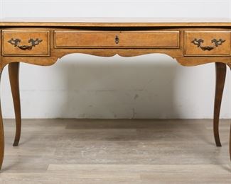 108	Baker Louis XV Provincial Style Writing Desk	"Louis XV Provincial style writing desk by Baker Furniture. American, 20th century. Cabriole legs and three drawers. Baker Furniture label on inside of right drawer. Scratches, scuffs, ring stains, and wear throughout top of table. Chips to wood throughout edges of top of table. Scratches and scuffs to left and right sides of desk. Nicks and marks to wood on legs of table. Marks to wood directly under central drawer.

48 1/2"" W x 23"" D x 29 1/4"" H. 60 lbs."
