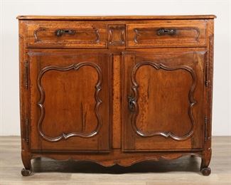 110	Louis XV Provincial Commode	"Louis XV Provincial commode. 19th century. Two drawers each with horizontal escutcheons, two doors open to reveal interior with one shelf. Three original keys, each specific to drawers and door, are included.  Wear, scuffs, marks and scratches throughout top of commode. Split and crack to wood on left drawer. Later bottom paneling on interior of commode. Split and crack to bottom paneling of interior of drawer. 

47 5/8"" W x 21 1/2"" D x 39 5/8"" H. 141 lbs."
