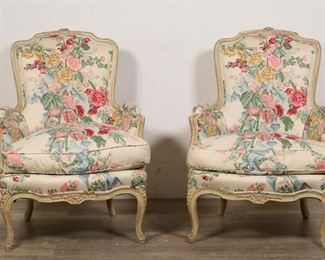 113	Pair of Louis XV Style Bergere Armchairs	"Pair of Louis XV style 'bergeres' or closed armchairs. 20th century. Carved wooden frame, floral upholstery, cabriole legs. Light stains to seat cushions of both chairs. Nicks and scuffs to legs of both chairs. Small tear to upholstery on back of one chair. Small losses to floral carving on top of one chair. 

27"" W x 31"" D x 37 1/2"" H. 60 lbs total."
